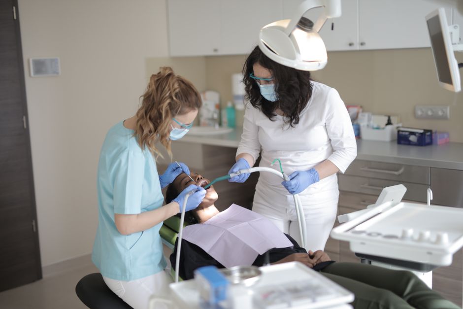 Dental professionals treating a patient in a modern clinic